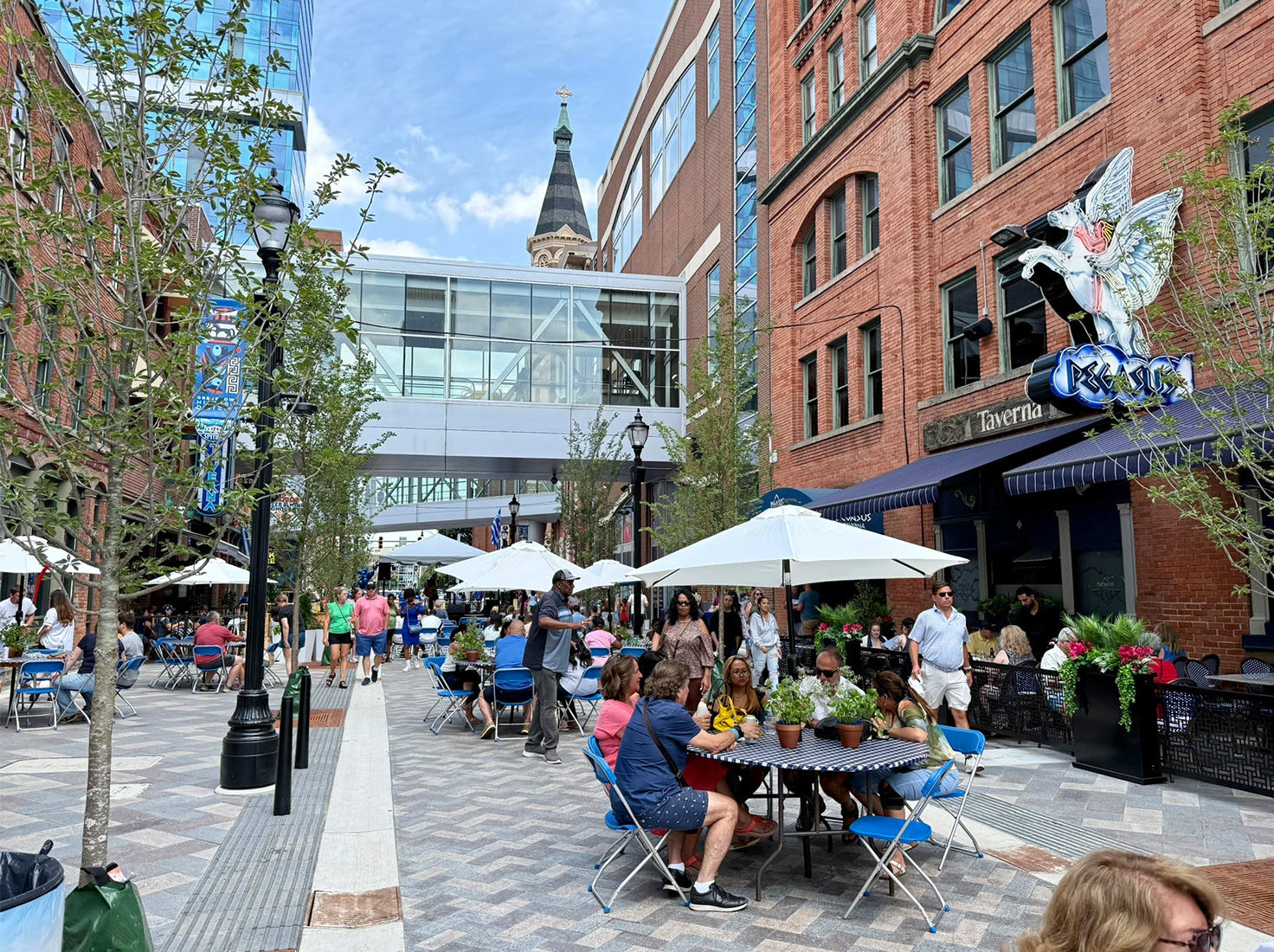 Photo of a special event on Monroe Street in Detroit's Greektown highlighting how the curbless design allows the street to become a public plaza