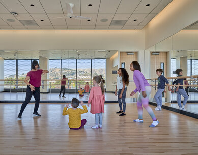 Photo of indoor recreation space with children's movement class at South San Francisco Civic Center